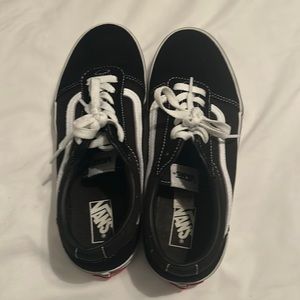 Black and white pair of vans.